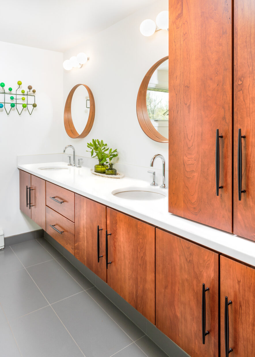 bathroom-design-cabinetry-storage-round-mirrors