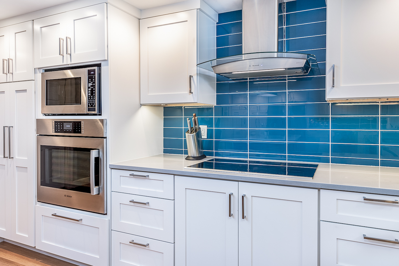 blue-tile-backsplash-kitchen-design-white-cabinetry