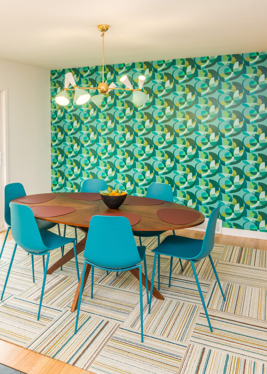 dining-table-blue-chairs-patterned-accent-wall-wallpaper