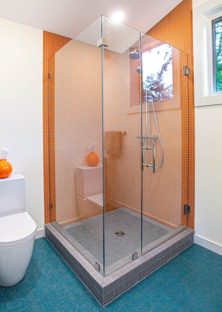 glass-shower-design-orange-tile-gray-floor-tile