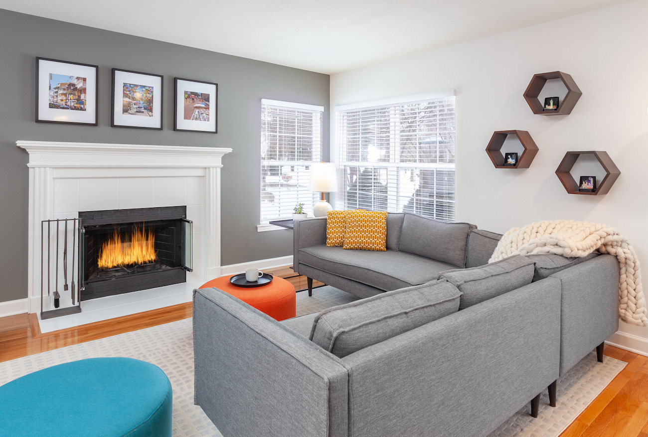 living-room-interior-design-gray-sofa-fireplace