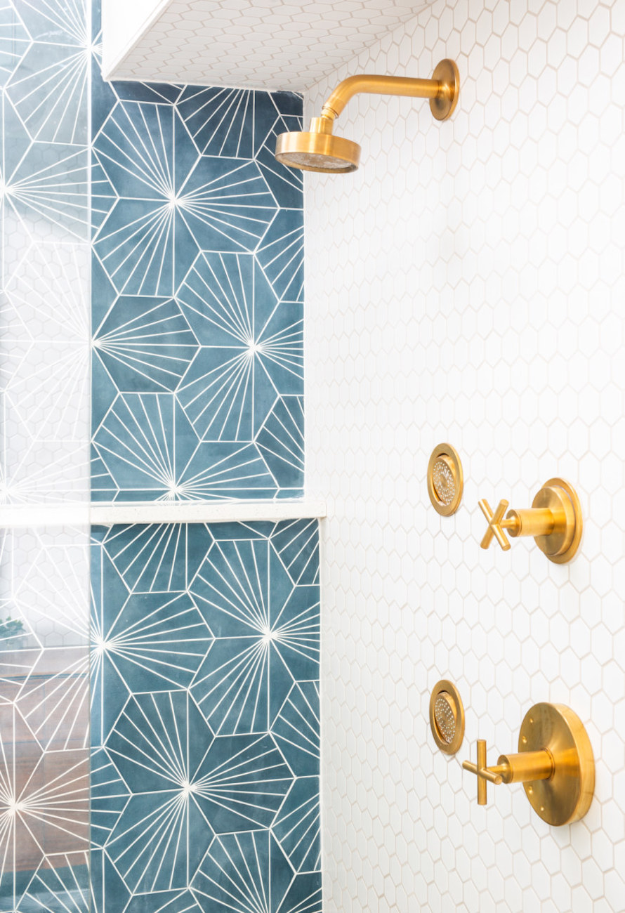 gold-shower-head-blue-tile-backsplash