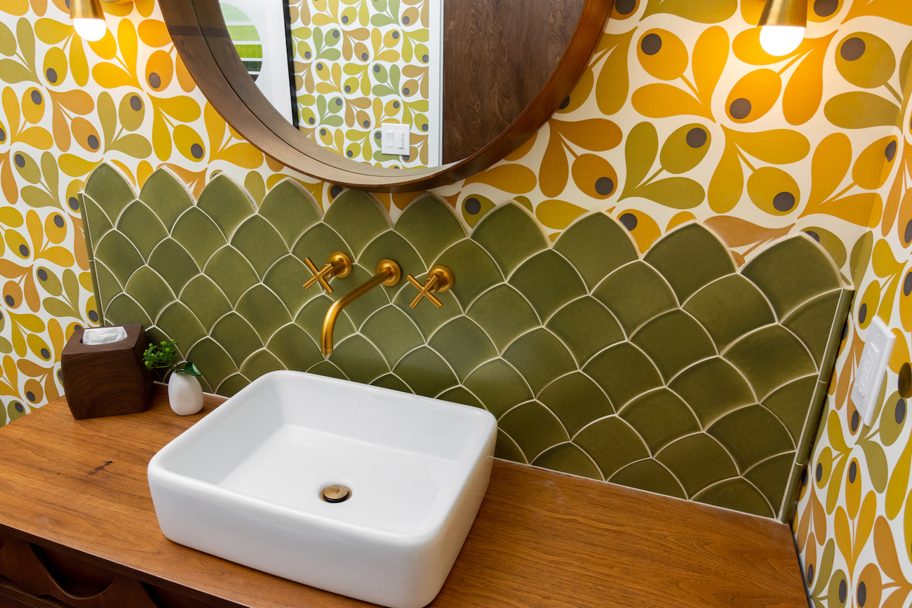 green-tile-backsplash-gold-faucet-bathroom-design
